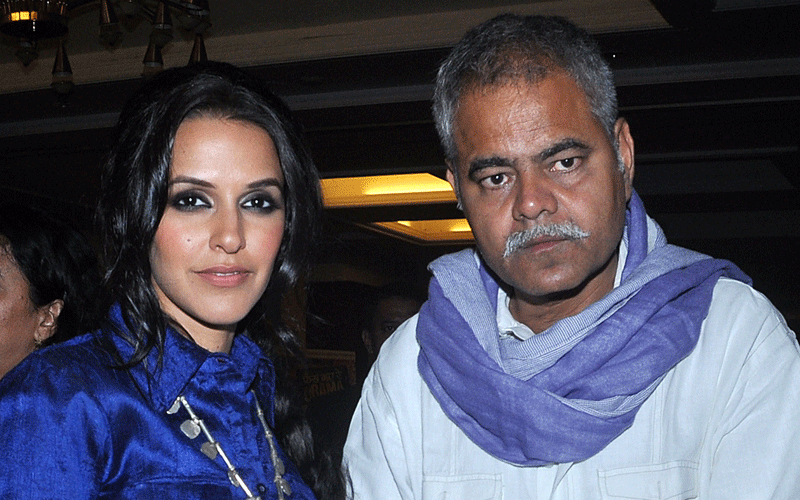 Indian Bollywood actress Neha Dhupia (L) and Sanjay Mishra pose during the music launch of the upcoming Hindi film &ldquo;Phas Gaya Re Obama&rdquo; directed by Subhash Kapoor in Mumbai. (AFP)