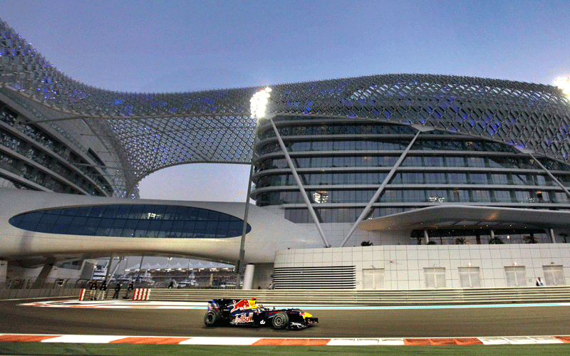 Red Bull driver Sebastian Vettel of Germany passes the Yas Marina hotel during the qualifying session at the Yas Marina racetrack in Abu Dhabi, United Arab Emirates. The Emirates Formula One Grand Prix will take place on Sunday. (AP)