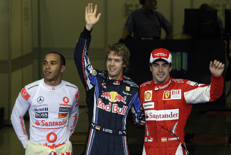 Sebastian Vettel (centre) claimed pole position ahead of Lewis Hamilton (left) and Fernando Alonso during qualifying on Sunday for the Abu Dhabi Grand Prix at Yas Marina Circuit. (PATRICK CASTILLO)