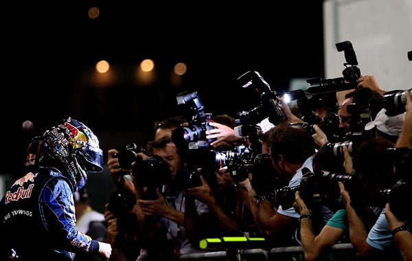 Sebastian Vettel of Germany and Red Bull Racing celebrates after qualifying for the Abu Dhabi Formula One Grand Prix at the Yas Marina Circuit. (GETTY)