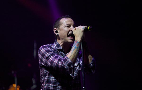Chester Bennington,lead singer of the American rock band "Linkin Park", performs in Yas Island on the second night of the F1 motor race meeting in Abu Dhabi, United Arab Emirates. (AP)