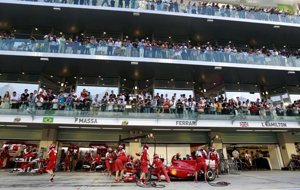Ferrari's Spanish driver Fernando Alonso stops in the pits of the Yas Marina circuit on November 13, 2010 in Abu Dhabi, during the qualifying session of the Abu Dhabi Formula One Grand Prix. (AFP)