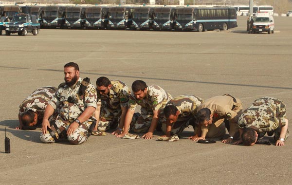 Saudi security forces pray before a parade in preparation for the annual haj pilgrimage in Mecca. (REUTERS)