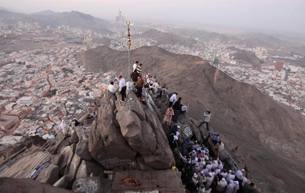 Muslim pilgrims stand on Mount Al-Noor during the annual haj pilgrimage in Mecca. (REUTERS)