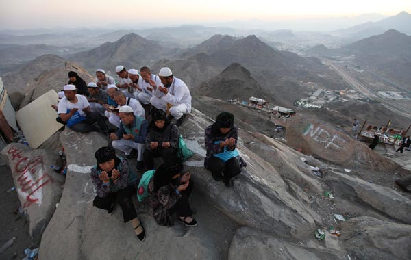 Muslim pilgrims pray atop Mount Al-Noor during the annual haj pilgrimage in Mecca. (REUTERS)
