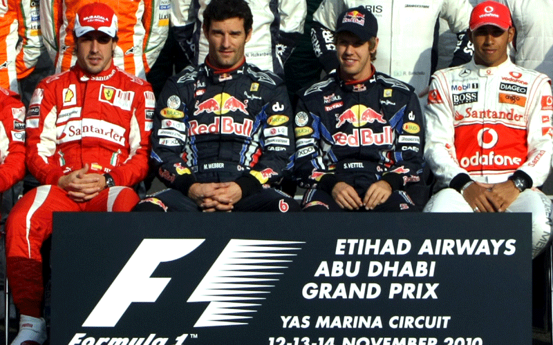 ( Left to Right)  Ferrari's Spanish driver Fernando Alonso, Red Bull's Australian driver Mark Webber, Red Bull's German driver Sebastian Vettel, and McLaren Mercedes' British driver Lewis Hamilton sit during a family photo ahead of racing at the Yas Marina circuit in Abu Dhabi, during the Abu Dhabi Formula One Grand Prix. (AFP)