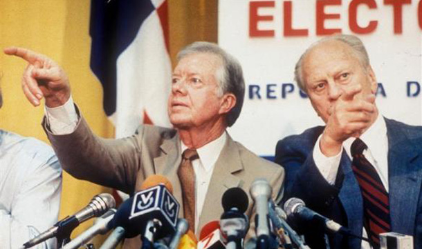 Former Presidents Jimmy Carter and Gerald Ford point in different directions while calling on reporters wanting to ask questions at a press conference in Panama City. Ford and Carter were in Panama as co-chairmen of a international delegation to observe Panamanian presidential elections. (REUTERS)
