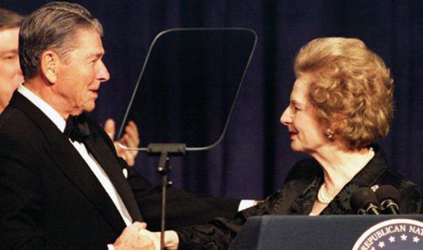 Former British Prime Minister Margaret Thatcher shakes hands with former President Ronald Reagan as she participates in a birthday salute celebrating Reagan's 83rd birthday in Washington. (REUTERS)