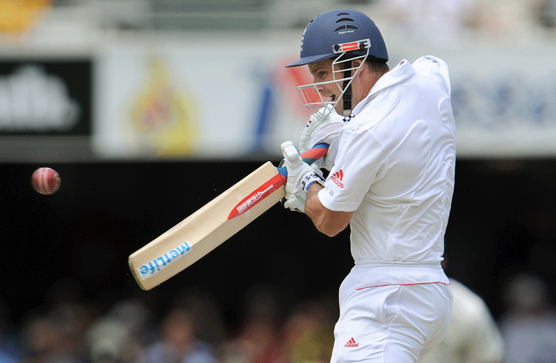 England captain Andrew Strauss slashes at a ball and is caught by Michael Hussey of Australia in the first over of the first day of the first Ashes Test in Brisbane on Thursday. (AFP)