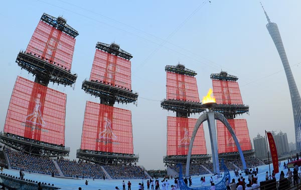 The Asian Games couldron burns a few hours before the beginning of the closing ceremony, at the area that will be holding the closing ceremony, during the 16th Asian Games in Guangzhou. (AFP)