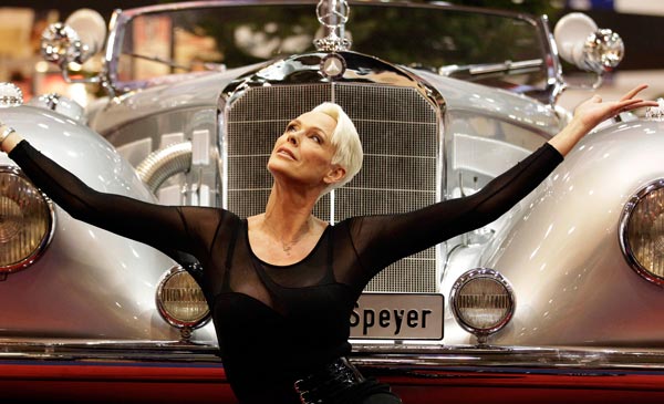 Danish actress Brigitte Nielsen poses in front of a 500 Mercedes Benz car, which was built in 1935, in Essen, Germany. (AP)