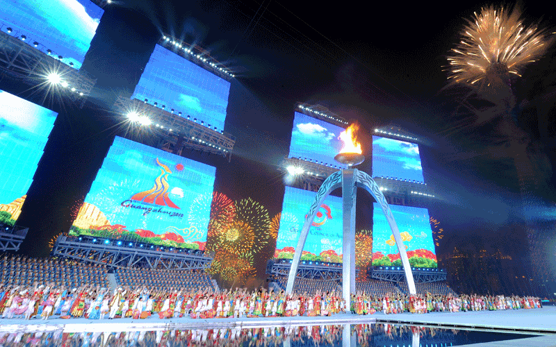 Performers act on stage as fireworks explode from Canton Tower (R) during the closing ceremony for the 16th Asian Games in Guangzhou. An "extraordinary" Asian Games prepared to close after 15 days of thrills and spills that saw China reinforce its sporting credentials and Japan slip further behind. (AFP)