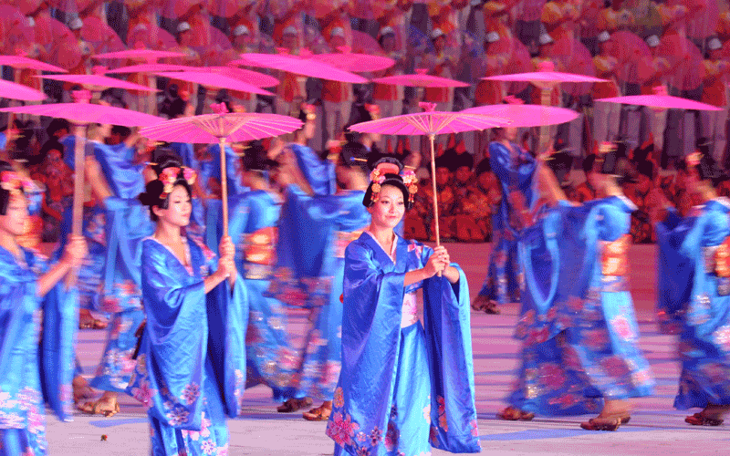 Performers dance on stage during the closing ceremony for the 16th Asian Games in Guangzhou. An "extraordinary" Asian Games prepared to close after 15 days of thrills and spills that saw China reinforce its sporting credentials and Japan slip further behind. (AFP)