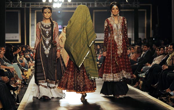 Models display creations of Pakistani designer Nomi Ansari during a Bridal Couture Week 2010 in Lahore. (AFP)