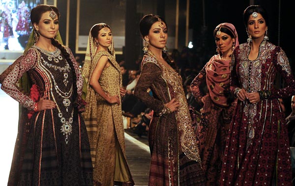 Models display creations of Pakistani designer Nomi Ansari during a Bridal Couture Week 2010 in Lahore. (AFP)