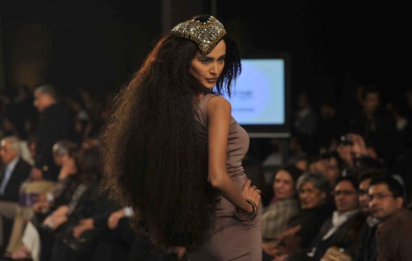 A Pakistani model  displays a creation of Pakistani designer Mehdi and hair dresser Athar Shahzad on the last day of the Bridal Couture Week 2010 in Lahore. (AFP)