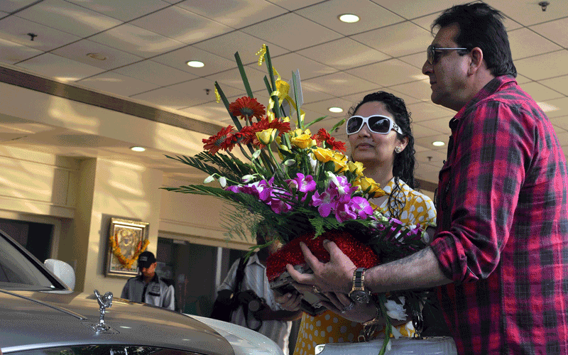 Indian Bollywood actor Sanjay Dutt (right) buys a Rolls Royce 'Ghost' model car to his wife Manyata Dutt (left) in Mumbai after she gave birth to twins. (AFP)