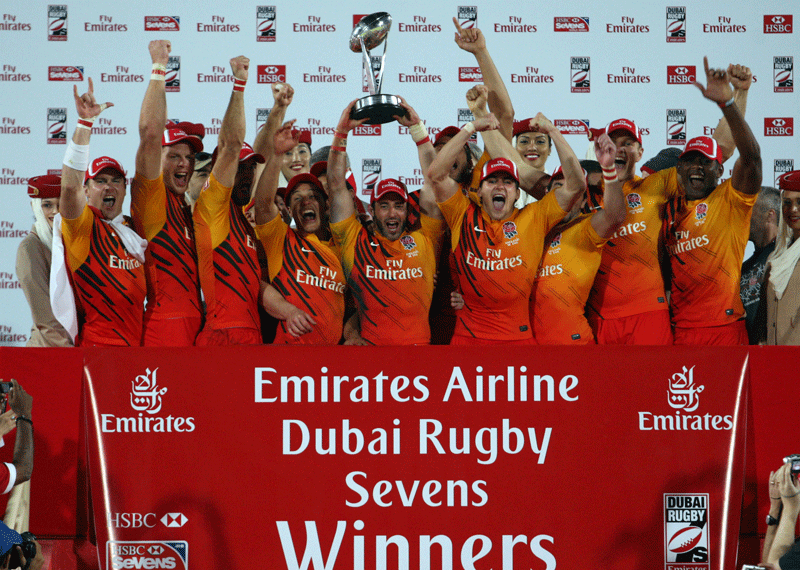 England team celebrate after winning the Emirates International Trophy by defeating Samoa in the final at the Emirates Airline Dubai Rugby Sevens tournament at The Sevens stadium on Saturday. (PATRICK CASTILLO)