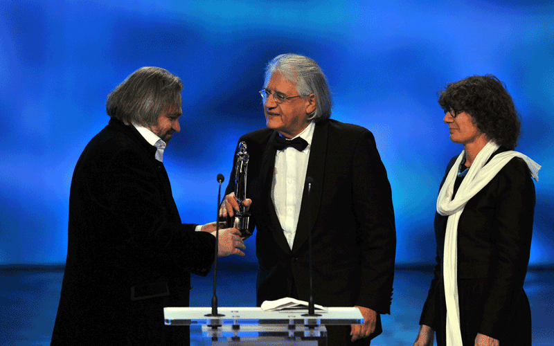 Chilean documentary film director Patricio Guzman (centre) receives the European Film Academy documentary award for his film "Nostalgia de la Luz" (Nostalgia for the Light) at the 23rd European Film Awards, the continent's version of the Oscars, in Tallinn. (AFP)
