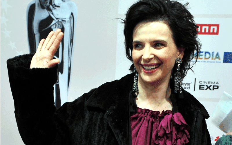 French Actress Julliette Binoche poses on the red carpet during the 23rd European Film Awards ceremony in Tallinn. (AFP)
