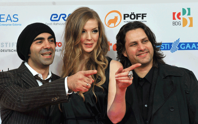 German film director Fatih Akin (left), actress Pheline Roggan (centre) and actor Adam Bousdoukos (R) pose on the red carpet during the 23rd European Film Awards ceremony in Tallinn. (AFP)