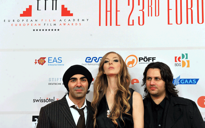 German film director Fatih Akin (left), actress Pheline Roggan (centre) and actor Adam Bousdoukos (right) pose on the red carpet during the 23rd European Film Awards ceremony in Tallinn. (AFP)
