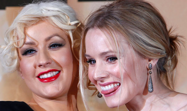 Singer and actress Christina Aguilera, left, and actress Kristen Bell smile during the Japan premiere of their film "Burlesque" in Tokyo, Japan. (AP)