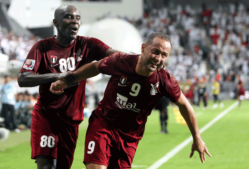 Al Wahda's Fernando Baiano (right) celebrates with Hugo after scoring a goal against Hekari United during Fifa Club World Cup at Mohammed bin Zayed Stadium in Abu Dhabi on Wednesday. (OSAMA ABUGHANIM)