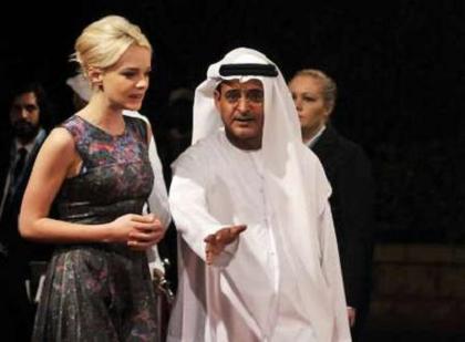 British actress Carey Mulligan is greeted by Chairman of the event Abdel Hamid Jumaa on the red carpet for the opening ceremony of the seventh edition of the Dubai International Film Festival on Sunday (REUTERS)