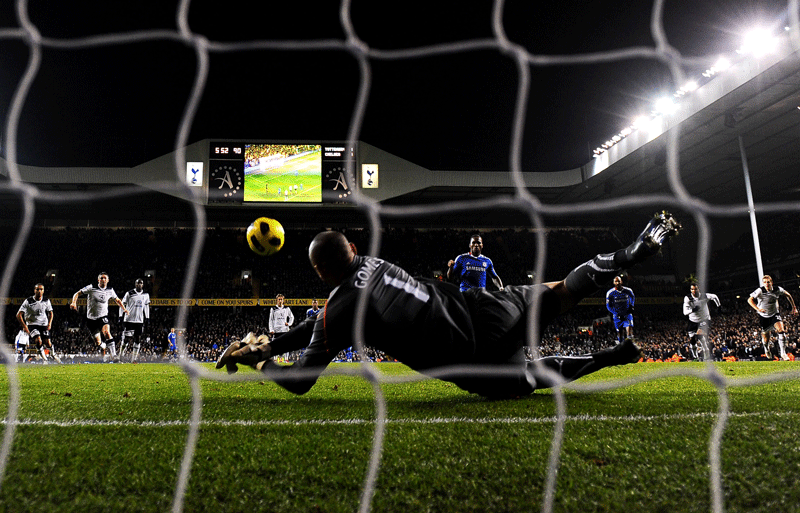 Goalkeeper Heurelho Gomes of Spurs saves the penalty from Didier Drogba of Chelsea to keep the score at 1-1 during the Premier League match at White Hart Lane in London on Sunday. (GETTY)