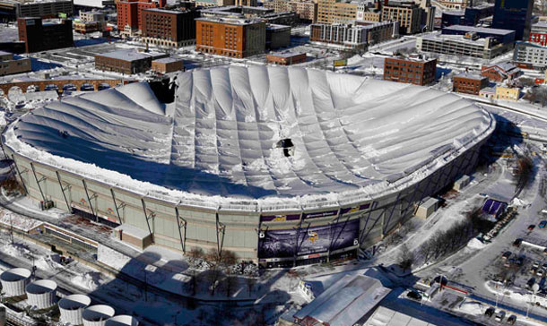 Holes in the collapsed Metrodome roof can be seen in Minneapolis. The inflatable roof of the Metrodome collapsed Sunday after a snowstorm that dumped 17 inches on Minneapolis. No one was hurt, but the roof failure sent the NFL scrambling to find a new venue for the Vikings' game against the New York Giants. (AP)