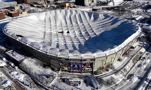 The collapsed roof of the Metrodome is shown in this aerial view in Minneapolis. The inflatable roof of the Metrodome collapsed Sunday after a snowstorm that dumped 17 inches on Minneapolis. No one was hurt, but the roof failure sent the NFL scrambling to find a new venue for the Vikings' game against the New York Giants. (AP)