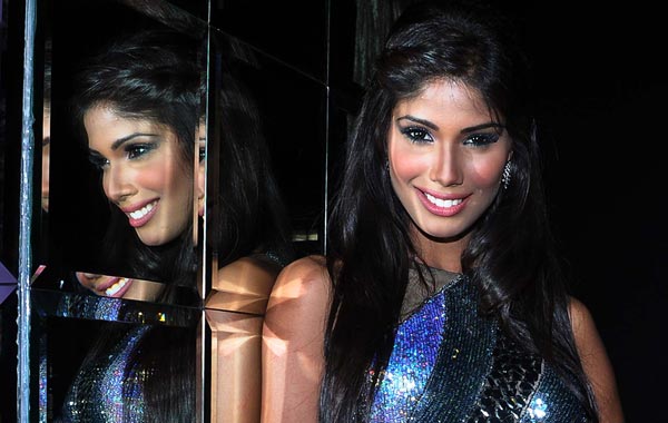 Indian model, beauty queen and winner of Miss Earth 2010 Nicole Faria poses for the camera during a press conference in Mumbai. (AFP)