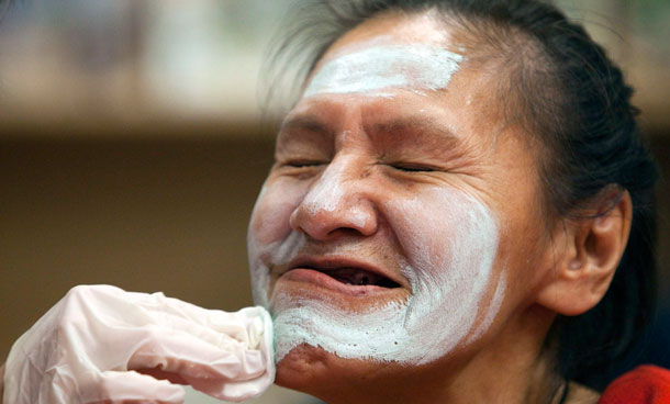 Marguerite Roch receives a facial during the 10th anniversary of Beauty Night at the PHS Life Skills Centre Downtown Eastside in Vancouver, British Columbia. The weekly event in which volunteers offer free makeovers to women at the shelter is celebrating its 10th year. (REUTERS)