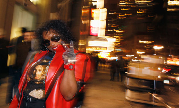 A Michael Jackson fan dressed as the late pop star waits in a line to celebrate the release of the album Michael in New York. (REUTERS)