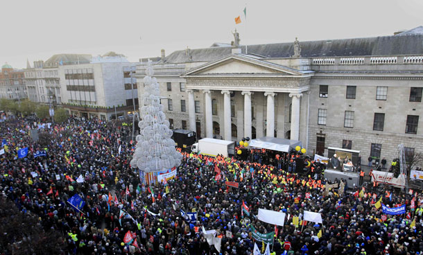 Thousands of Protesters hold a rally at the General Post Office in Central Dublin, Ireland.  Over one hundred thousand people marched through the city to protest against the Republic's four-year austerity plan. Braving high unemployment and unsustainable levels of debt and budget deficits in Europe and the US, the world economy is expected to slow in 2011 with economists cutting their forecasts for growth in developed countries. On the upside, Asian economies will continue to spearhead the global economic recovery. (AP)