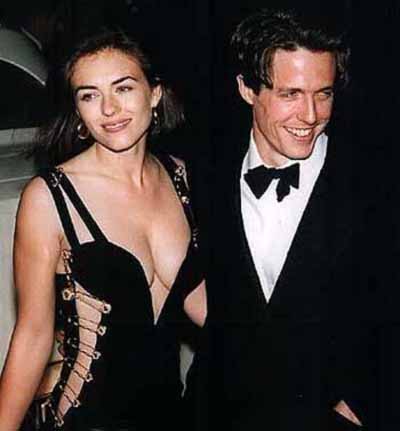 Elizabeth Hurley shot to fame in 1994, seven years after she first met Hugh Grant. Whe she accompanied him to the Los Angeles premiere of 'Four Weddings and a Funeral' in a plunging black Versace dress held together with gold safety pins, she made headlines around the world (GETTY IMAGES)