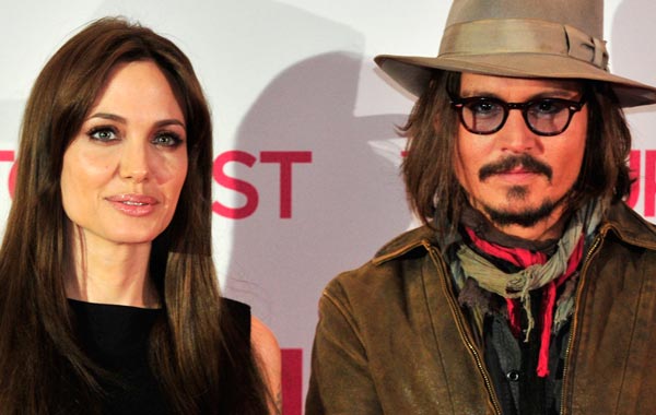 (From L) US actress Angelina Jolie and US actor Johnny Depp pose for photographers during a photo-call for the movie The Tourist, by German director Florian Henckel von Donnersmarck, in Berlin. (AFP)