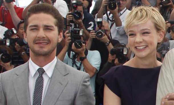 Cast members Shia LaBeouf (L) and Carey Mulligan pose during a photocall for the film "Wall Street - Money never sleeps" by US director Oliver Stone during the 63rd Cannes Film Festival in Cannes. (REUTERS)