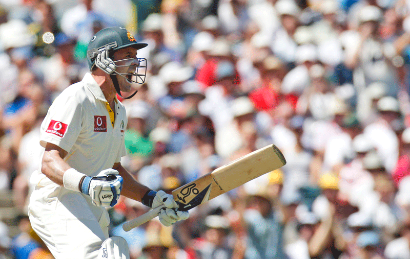 Australia’s Michael Hussey celebrates scoring a century on day three of the third Ashes Test in Perth on Saturday. (AP)