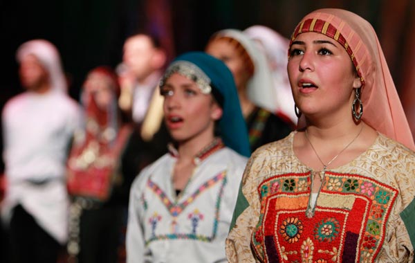 Palestinian dancers of the Hanouneh troupe perform a dance entitled "Guardians of Memory" as part of activities to commemorate the division of the Palestinian state in Amman. (REUTERS)