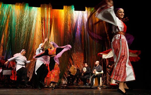 Palestinian dancers of the Hanouneh troupe perform a dance entitled "Guardians of Memory" as part of activities to commemorate the division of the Palestinian state in Amman. (REUTERS)