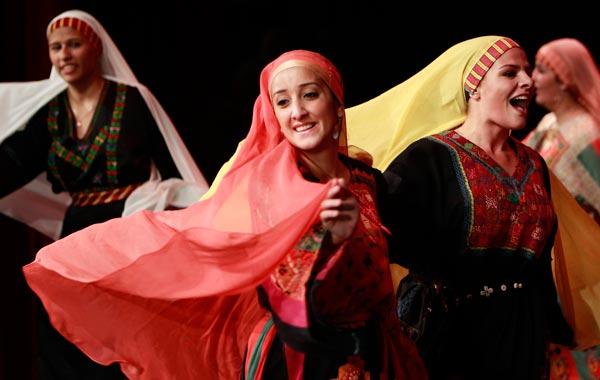 Palestinian dancers of the Hanouneh troupe perform a dance entitled "Guardians of Memory" as part of activities to commemorate the division of the Palestinian state in Amman. (REUTERS)