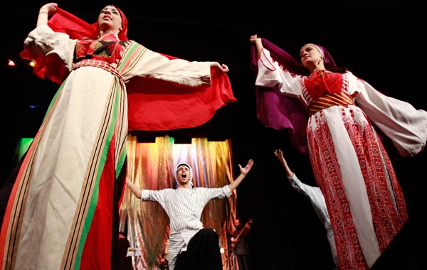 Palestinian dancers of the Hanouneh troupe perform a dance entitled "Guardians of Memory" as part of activities to commemorate the division of the Palestinian state in Amman. (REUTERS)