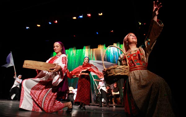Palestinian dancers of the Hanouneh troupe perform a dance entitled "Guardians of Memory" as part of activities to commemorate the division of the Palestinian state in Amman. (REUTERS)