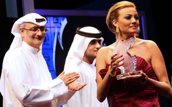Egyptian actress Bushra receives the best actress award during the closing ceremony of the Seventh Dubai International Film Festival (DIFF) on December 19 (AFP)
