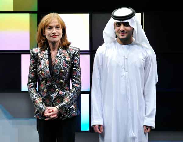 Actress Isabelle Huppert and His Highness Sheikh Saeed Bin Mohammed Bin Rashid Al Maktoum on stage during the Closing Night Muhr Awards Ceremony on day eight of the 7th Annual Dubai International Film Festival held at the Madinat Jumeirah Complex on December 19 (AFP)