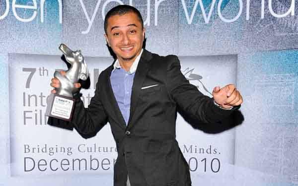 Director Mohammed Al Hushki celebrates with his Muhr Arab Feature Special Jury Prize for "Transit Cities" during the Closing Night Muhr Awards Ceremony on day eight of the 7th Annual Dubai International Film Festival held at the Madinat Jumeirah Complex on December 19 (GETTY IMAGES)