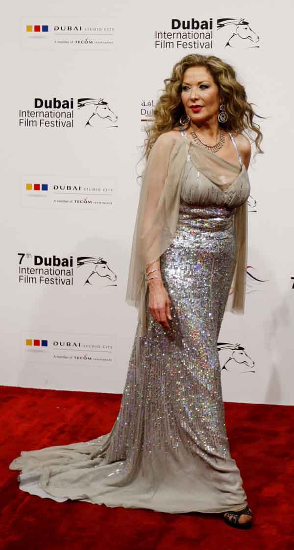 Syrian actress Raghda arrives for the red carpet closing night and awards ceremony of the 7th Dubai International Film Festival on Sunday (REUTERS)