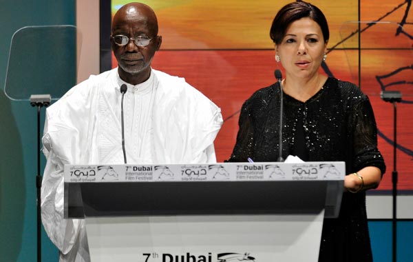 Lifetime Achievement honouree director Souleymane Cisse (L) on stage during the Closing Night Muhr Awards Ceremony on day eight of the 7th Annual Dubai International Film Festival held at the Madinat Jumeriah Complex. (GETTY)
